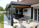 Aanbouw veranda met terrasoverkapping en houten afwerking in Blankenberge - Van Der Bauwhede