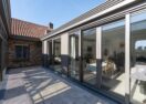 Landelijke veranda met eetkamer in Evergem - Van Der Bauwhede